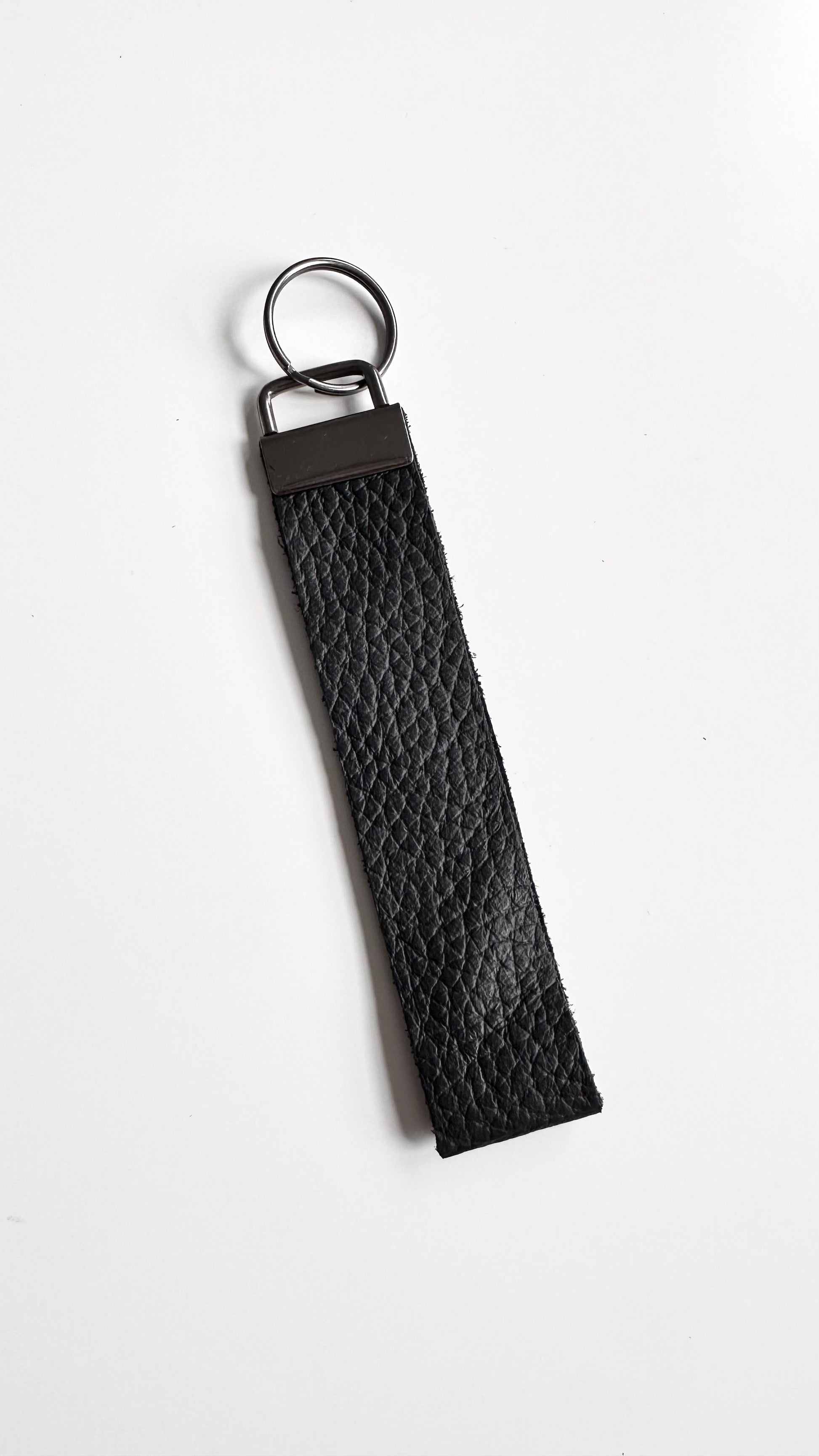 Black genuine leather wristlet keychain.