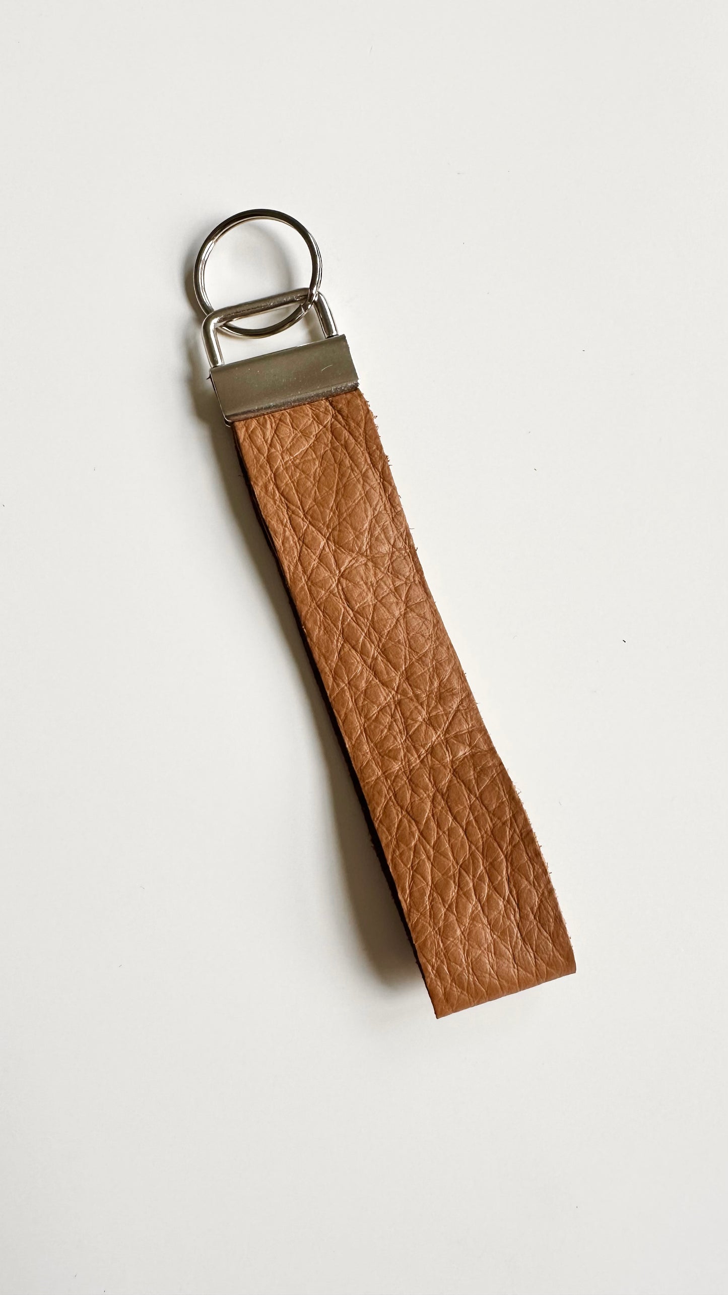 Tan genuine leather wristlet keychain.