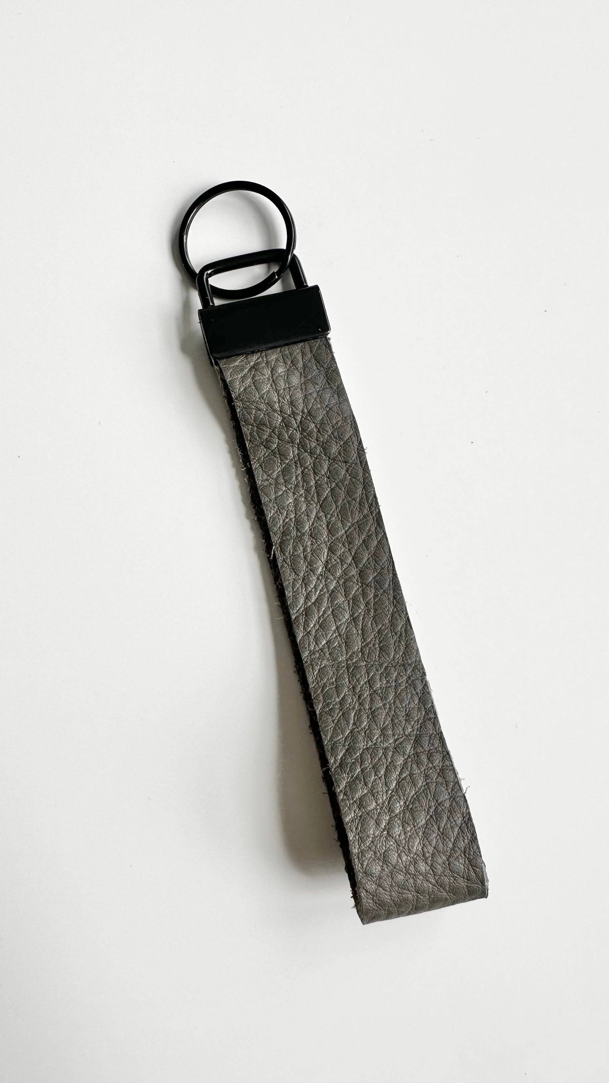 gray genuine leather wristlet keychain.